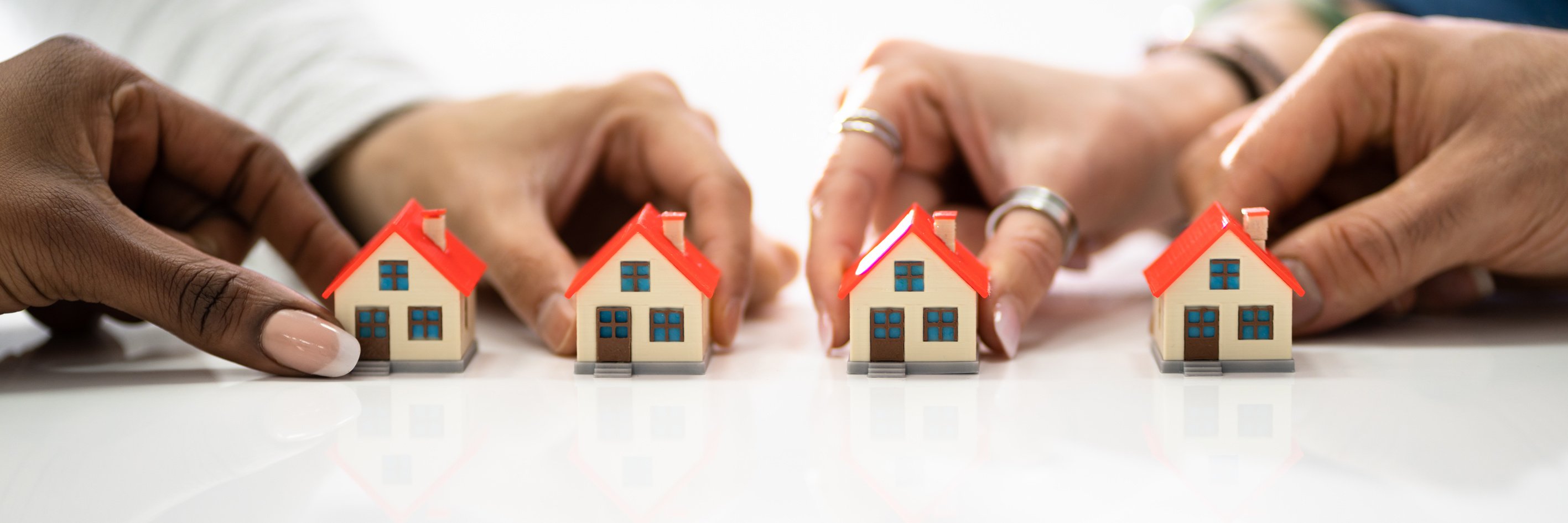 Homeowner Association By People Holding House Model